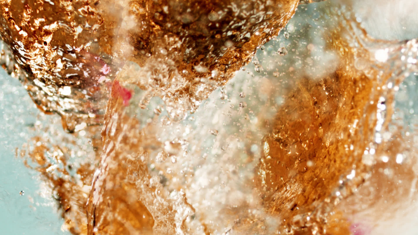 Beautiful slow-motion splashing. The yummy syrupy liquid in 1000+ fps. Works for cider, beer, prosecco, pink wine, apple juice, juice, rum, liquor, rye whiskey. Refreshing cold beverage. Royalty-Free Stock Footage #1056279683