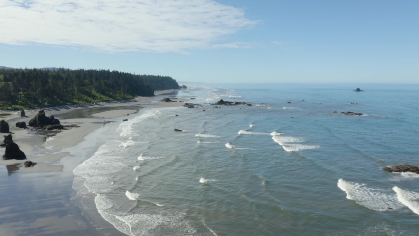 Drone Flies Backwards Revealing Massive Boulder on Coastal Ruby Beach in Olympic National Park, Washington State Royalty-Free Stock Footage #1056281282