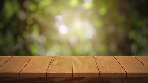 Wood table bar and nature tree blurred background, Top wood table space area for products show. 3840x2160. 4K UHD. Video Clip.