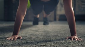 Detail of woman exercising on the floor at home.Woman doing push-ups at home. Woman fitness training on the ground. Industrial style house - Powered by Shutterstock - Get 15% off with code: PIKWIZARD15