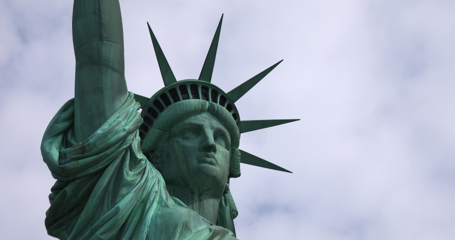 Statue of Liberty face and crown on a bright day in New York City.