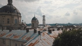Aerial drone video of city Lviv, Ukraine. Flight over roofs, streets. Panorama of popular central part of old european town Lvov, Ukraine. Rynok Square, Central Hall, Ratusha, Ukraine Dominican Church