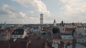 Aerial drone video of city Lviv, Ukraine. Flight above roofs and streets. Panorama of ancient popular central part of old European town Lvov, Ukraine. Rynok Square, Central Hall, Ratusha. 4k footage