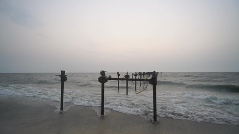 Alleppey Beach - Old Pier In Alappuzha Beach Under The Dramatic Sky In Kerala, India. -wide shot