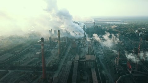 industry metallurgical plant sunrise bad ecology chimney smoke aerial 4K