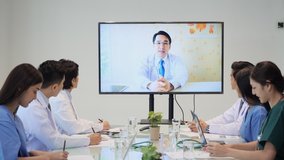 Medical people meeting and planning with shareholders in corporate office. Doctor and nurse video conference online at hospital. Medical teamwork collaborating for healthy of patients.