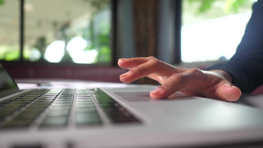 Close up of Woman's Finger using a laptop trackpad scrolling website for shopping online. Royalty-Free Stock Footage #1056314813