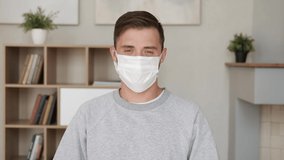 Happy man take off medical mask. Webcam view. End of the pandemic. Remote communication. Handsome man having online video chat conference working from home. Health care. Portrait male student closeup