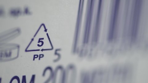 Closeup view of eco-labeling and other signs depicted on white background packaging spbd. Special mark on product guarantees environmental safety of entire production life cycle - from raw materials