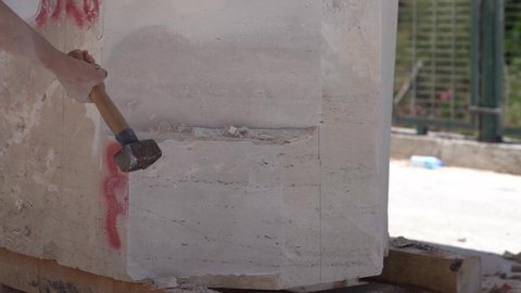 marble carving with hammer and chisel