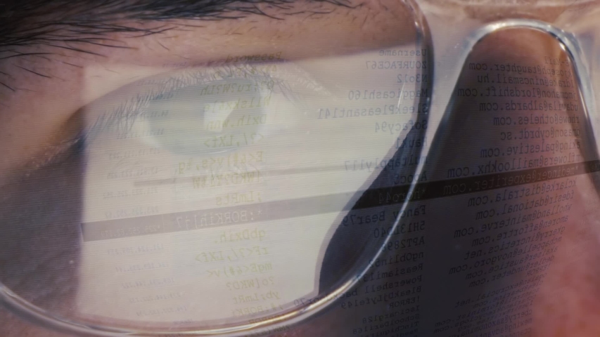 Computer screen reflected on male eyes and glasses - Hacking and Downloading file - Extreme close-up Royalty-Free Stock Footage #1056349043