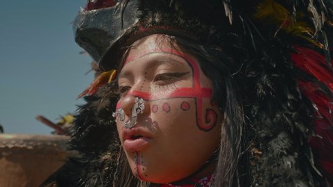 Aztec young woman singing aztec ritual 