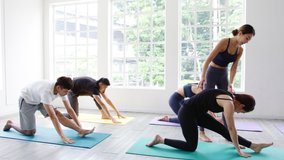 Young Asian sporty attractive people practicing yoga lesson with instructor. Asia group of women exercising healthy lifestyle in fitness studio. Sport activity, gymnastics or ballet dancing class. - Powered by Shutterstock - Get 15% off with code: PIKWIZARD15