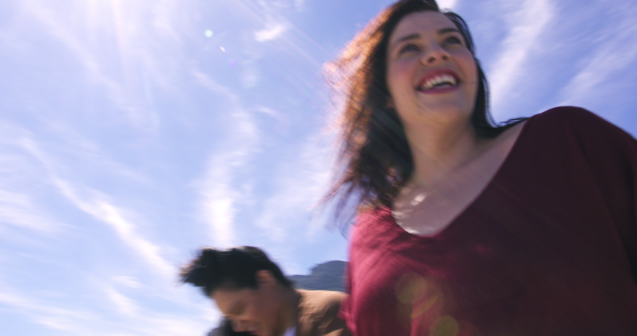MS Smiling brunette women walking on beach / Cape Town, South Africa