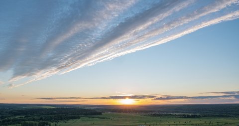 Aerial scene of high panoramic view at sunset. Beautiful clouds blue sky, sun glow cloud, background Sky, 4K, the sun shines through the clouds at sunset