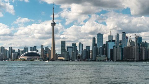 Toronto, Ontario, Canada, zoom out time lapse sequence showing Toronto skyline and Lake Ontario by day during summer. 