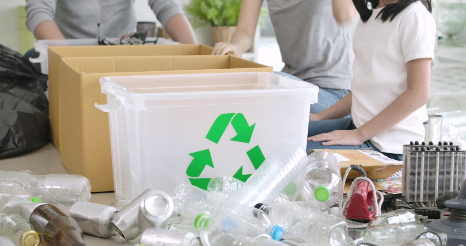 Happy responsible young asian family teaching their child sorting home garbage separate trash for further recycling at home together. zero waste, ecological friendly and saving the environment concept Royalty-Free Stock Footage #1056375119