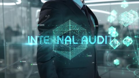 Businessman with Internal Audit hologram concept