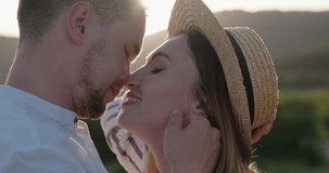 Close-up of young happy couple enjoying each other in nature. Slow motion video 4K