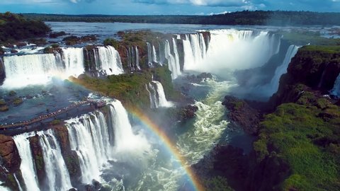Summer travel. Aerial landscape of giant waterfalls with beauty rainbow. Panorama view of famous Iguacu Falls. Vacation travel.Tropical travel. Travel destination. Summer leisure scene. Parana, Brazil