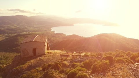 Panoramic sunset of Portoferraio Gulf, Elba Island, from mount Volterraio on which the fortress dominates north part of island of Tuscany Archipelago, Italy. Church of San Leonardo on background.