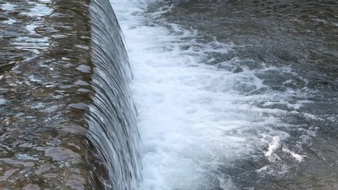 a weir on the stream water. slow motion