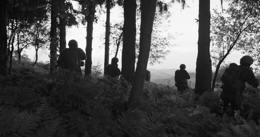 Group of soldiers protecting front line and conducting complex military action