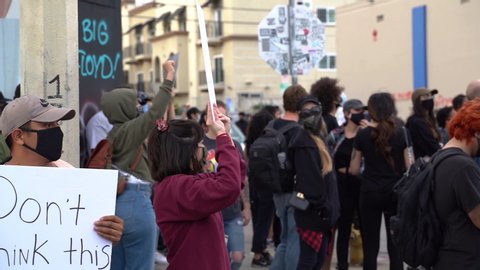 Los Angeles , California / United States - 07 05 2020: We Are With You Sign on Spanish at Black Lives Matter Protest. Latino Community Together With African Americans Against Police Brutality, Slow Mo