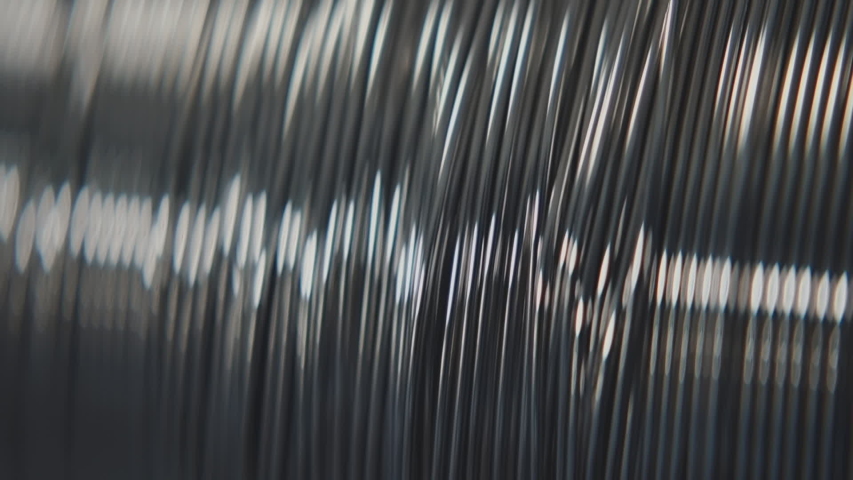 Steel making industry: Huge Coil of Metal Wires after Rolling Machine, Precious Metal Production Factory, Close Up, Slow Motion  | Shutterstock HD Video #1056399194