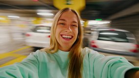 User generated content, couple pov girlfriend spinning with boyfriend in shopping mall parking lot. portrait of happy woman on wide angle action camera laughing and smiling, have great time in love - Powered by Shutterstock - Get 15% off with code: PIKWIZARD15