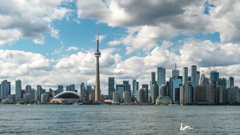 Toronto, Ontario, Canada, daytime time lapse view of Toronto skyline and Lake Ontario by day during summer. 
