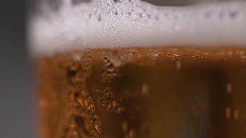 Cold Light Beer in a Glass Macro Shot at 4K UHD (side view)