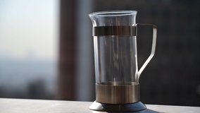 Accelerated video. Cooking green leafy tea in a French press. Timelapse.