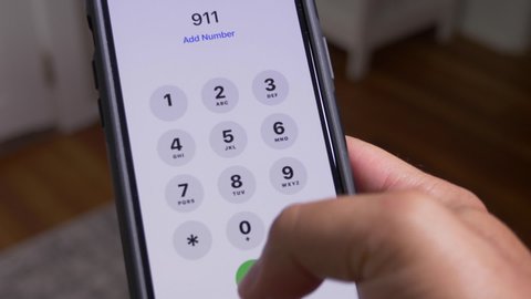 A closeup view of someone dialing 9-1-1 on their cellphone. 911 emergency services in America became a hot topic during the Defund the Police movement of 2020.	