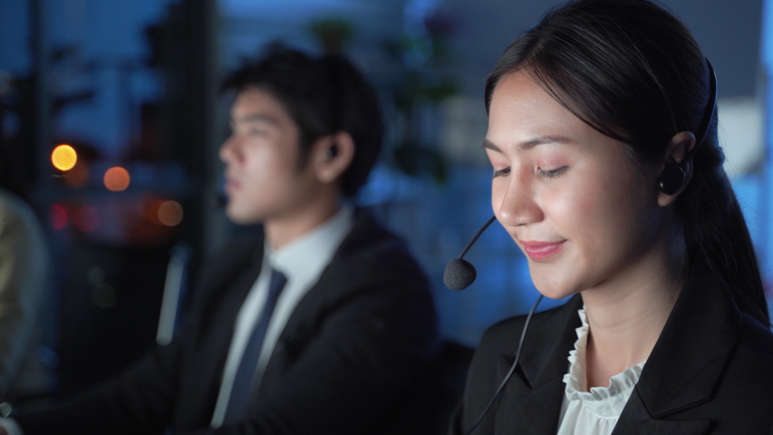 Call center to provide customer service 24 hours a day, Call center staff are also willing to service, will be at night Royalty-Free Stock Footage #1056415871