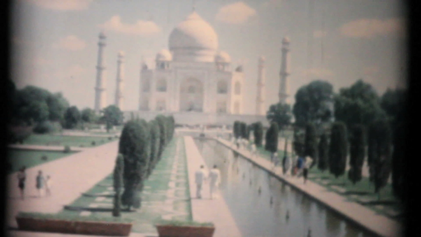 AGRA, INDIA, JUNE, 1957: Tourists enjoy exploring the beautiful Taj Mahal in Agra, India in the summer of 1957. 