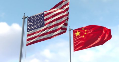 USA and China flag on flagpole. The United States of America and China waving flag in wind. US and China Trade War.