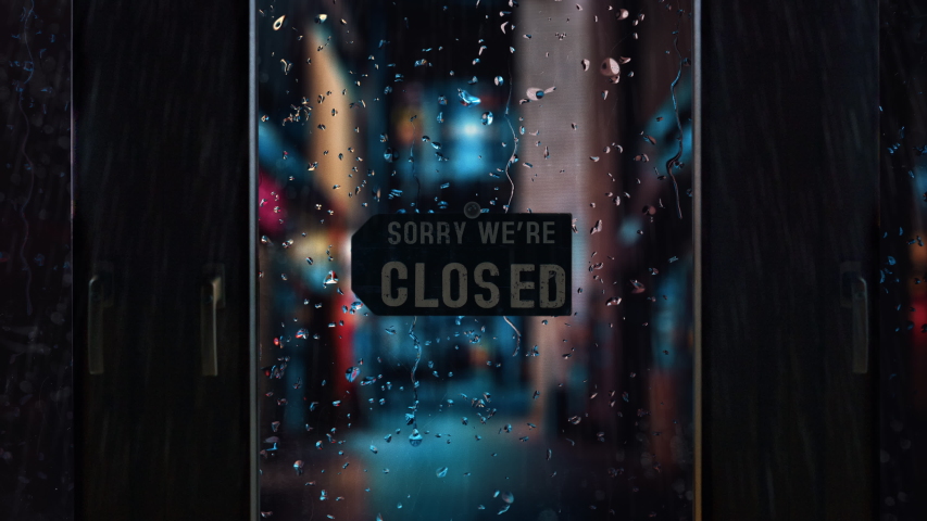 Cinematic mood shot of closed retail store shop due to coronavirus covid-19 pandemic , rainy look with raindrops on shop window | Shutterstock HD Video #1056418058