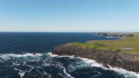 Aerial view over the Castle point, Kilkee, County Clare, Ireland.
This exposed cliff edge and popular fishing spot is the original location of Dunlicky Castle. Wild atlantic way.