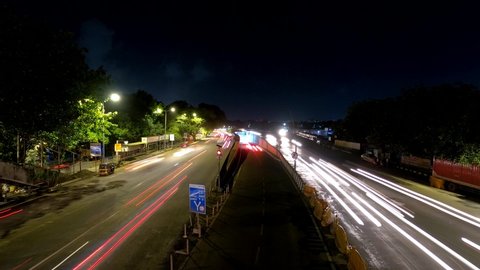4K Night Timelapse of hundreds of cars passing by on Western Express Highway Freeway of Mumbai as Covid19 lockdown rules are relaxed in the city. Long Exposure Light and Car trails. Maharashtra, India