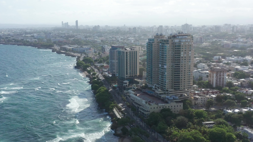 Aerial view of the buildings on George Washington Avenue, where we see the Malecon Center and hotels in the heart of the city of Santo Domingo Royalty-Free Stock Footage #1056425150