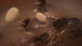 Almonds Nuts Falling Into Liquid Chocolate in 4K Super slow motion - Powered by Shutterstock - Get 15% off with code: PIKWIZARD15