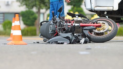 broken motorcycle on the road accident site