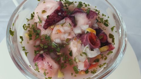 Close up of Caribbean classic octopus delicious ceviche served in glass dish