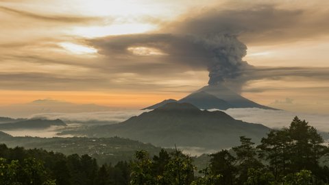 Timelapse of the eruption volcano Agung in Bali with beautiful views of the nature and volcano Batur and Abang. Big smoke and ash cover the sky. sunrise time in kintamani. unesco