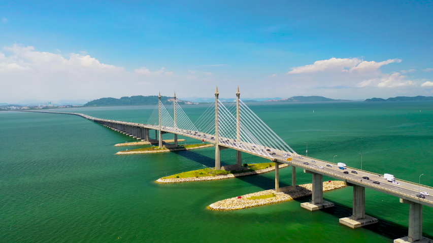 Aerial Orbiting Of Penang Bridge Malaysia With Beautiful Sky And Turquoise Water 4K Drone Cinematic Footage