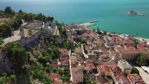 Aerial drone rotational video of historic and picturesque seaside old town of Nafplio as seen from Acronafplia castle, Argolida, Peloponnese, Greece