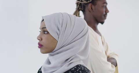Portrait of black muslim couple over white background