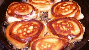 Dough pancakes are fried in a pan. Food photo. Sweet dish. Culinary recipe. Menu of dishes. Home kitchen. Cooking food. Dough dish. Promotional video. Pancake day.
