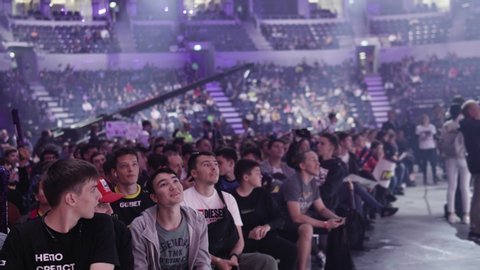 MOSCOW - 14 SEPTEMBER 2019: esports gaming event. Fans on a tribunes cheering and supporting for thier favorite teams.